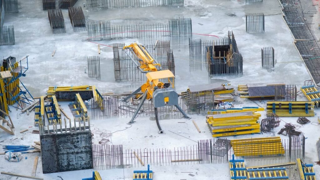 Yellow and black heavy equipment on snow covered ground