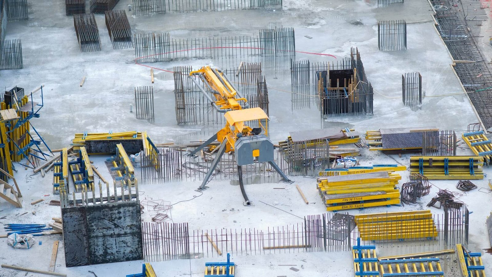 Yellow and black heavy equipment on snow covered ground